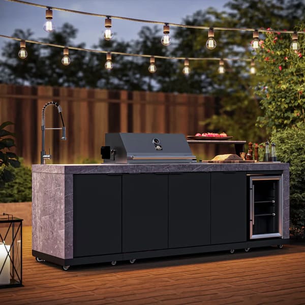 Outdoor patio setup featuring the FORNO Rimini 30-Inch Outdoor Kitchen, shown with a sleek stainless steel grill and cabinetry, set against a modern backyard backdrop for a stylish and functional open-air cooking experience.