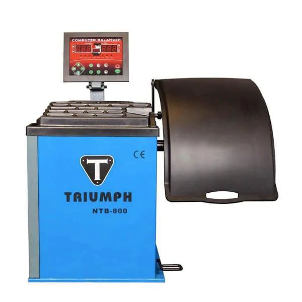 Triumph NTB-800 Wheel Balancer precision tire balancing machine with automatic data entry and foot pedal brake for accurate wheel weight placement.