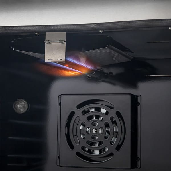 Close-up view of the interior gas burner inside the oven cavity of the FORNO 30-inch gas range from the 2-Piece Appliance Package, highlighting the lower bake burner with protective cover—designed for even heat distribution and efficient baking performance.