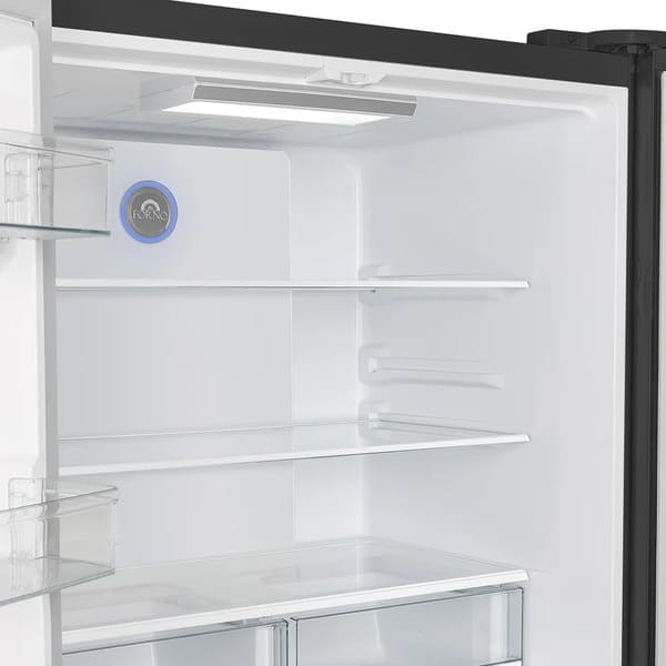 Interior view of the Forno 36-inch French door refrigerator showing the crisper drawers and adjustable glass shelves, designed for organized and flexible food storage.
