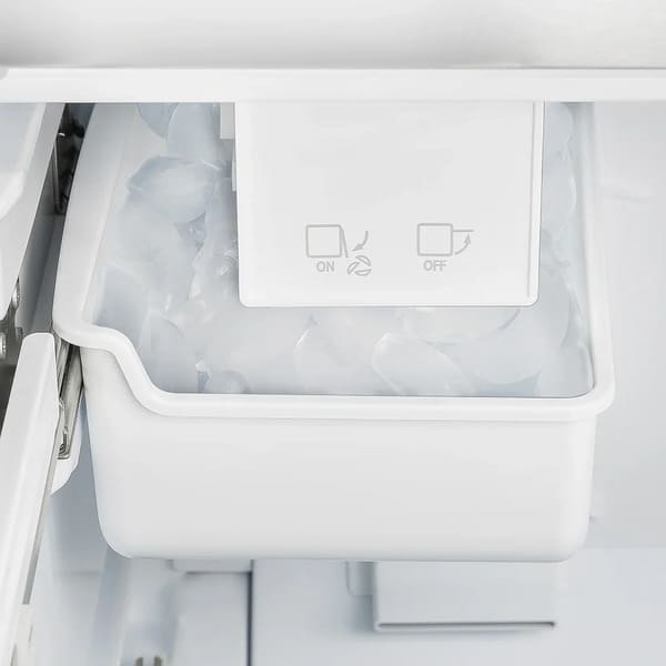 Close-up view of the built-in ice maker inside the Forno 36-inch French door refrigerator, showing the ice compartment and tray within the freezer section.