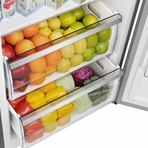 Detailed view of a lower interior drawer in the FORNO 60-inch built-in pro-style refrigerator from the 2-Piece Appliance Package, featuring a transparent design with smooth rails for easy access to produce or deli storage in a well-lit, organized compartment.