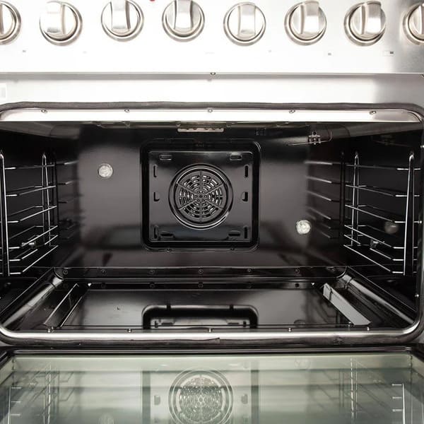 Interior view of the FORNO 36-inch gas range convection oven, featuring multiple racks and a powerful convection fan for even heat distribution.