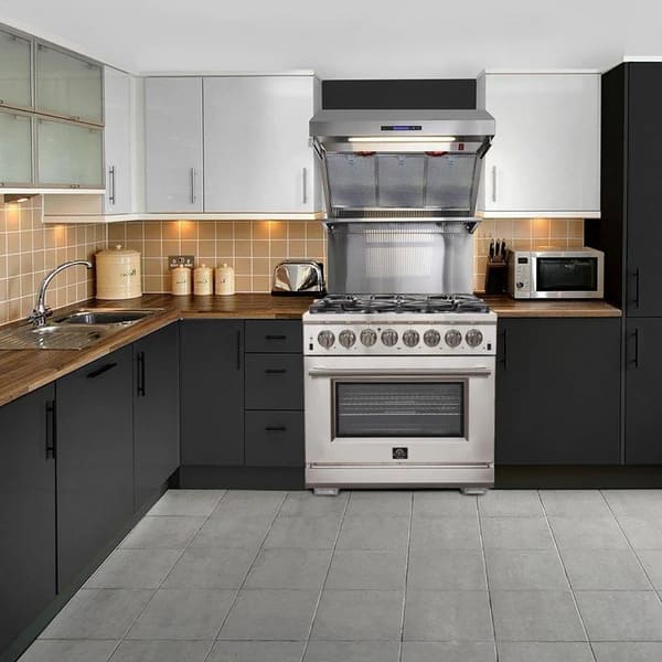 FORNO 36-inch gas range shown in a modern kitchen setting, featuring a stainless-steel finish, six burners, and French doors, blending performance with contemporary style.