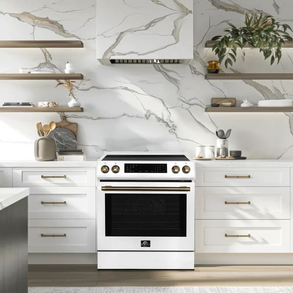 Lifestyle image of the FORNO 30-Inch Induction Range in white, shown in a modern kitchen setting with cabinetry and countertops for context.