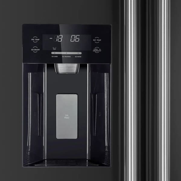 Close-up of the built-in ice maker inside the FORNO 36-Inch Side-by-Side Refrigerator with Water Dispenser in Black, showing the compact ice production unit and storage bin within the freezer compartment.