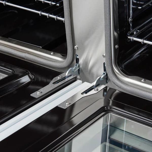 Close-up of the oven door hinges on the FORNO Antico 48-Inch Dual Fuel Range in white, highlighting the heavy-duty construction and smooth, durable hinge mechanism for reliable performance.
