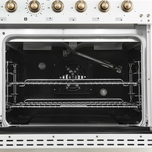 Interior view of the main oven in the FORNO Antico 48-Inch Dual Fuel Range in white, showcasing a vibrant blue enamel cavity, convection fan, and multi-position heavy-duty oven racks.