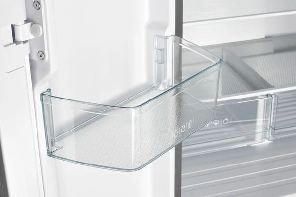 Close-up of a door bin inside the FORNO 30-inch French door refrigerator in stainless steel, showing the transparent, spacious design ideal for storing bottles and condiments.