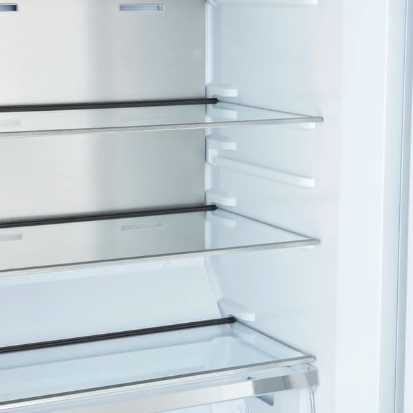 Close-up view of interior glass shelves in the FORNO Maderno 28-Inch Built-In 13.6 Cu. Ft. Convertible Refrigerator in white, highlighting adjustable storage and clean, modern layout.