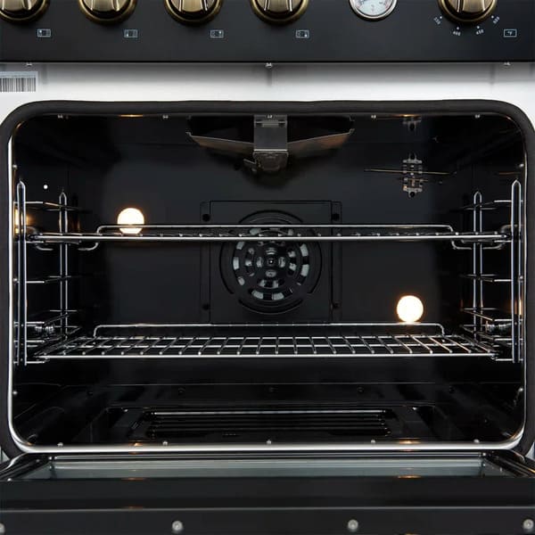 Interior view of the FORNO Marco 30-Inch Gas Range in black, featuring a vibrant blue enamel oven cavity, convection fan, and adjustable chrome racks for versatile multi-level cooking.