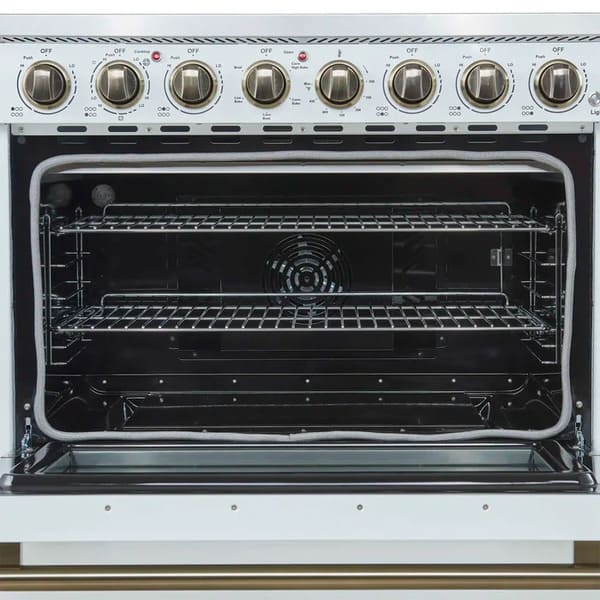 Close-up of the oven interior in the FORNO Paolo 36-Inch Electric Range in white, featuring a vibrant blue enamel cavity, convection fan, and heavy-duty oven racks for multi-level cooking.