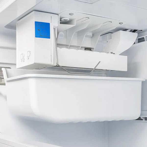 Close-up view of the ice maker inside the FORNO French door refrigerator, showing the built-in ice-making unit and surrounding freezer compartment for convenient ice storage.