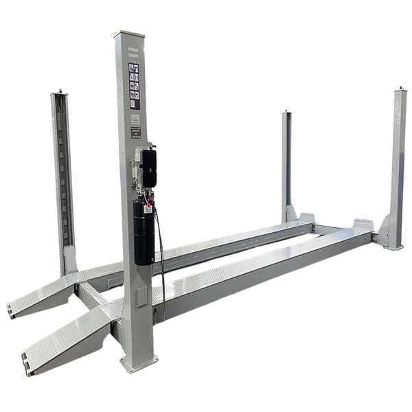 Triumph NTR-32 four post lift with reinforced diamond plate runways and 32,000 lbs capacity.