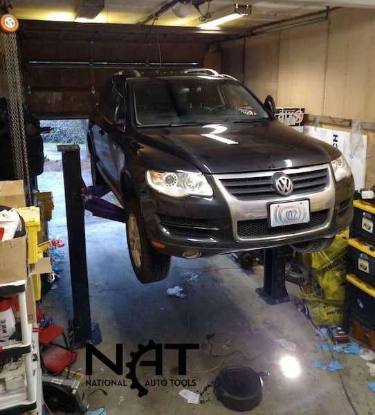 Triumph C7000 7,000 lb portable two post auto lift with car raised