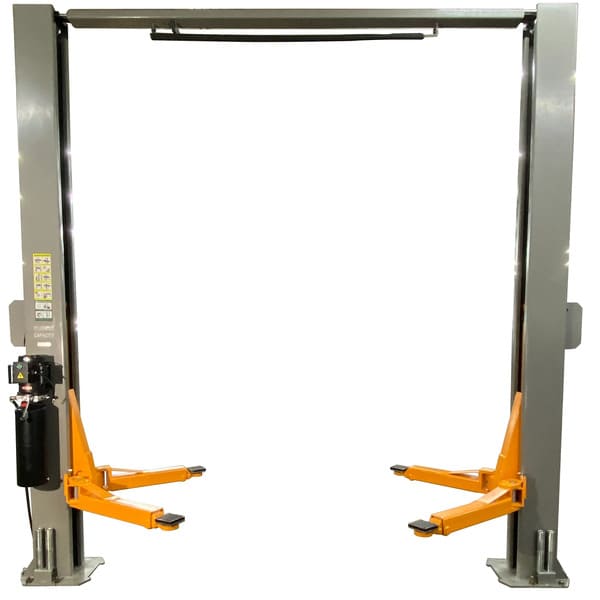Back view of Triumph NTO-11A two post auto lift showing columns and overhead support